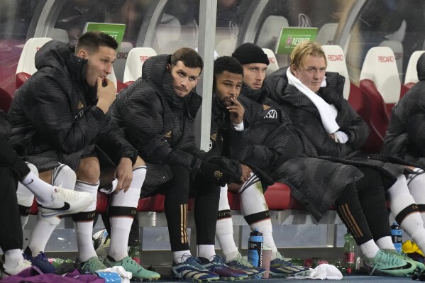 Germany players react as they sit on the bench during the international friendly soccer match between Austria and Germany at the Ernst Happel stadium in Vienna, Austria, Tuesday, Nov. 21, 2023. (AP Photo/Matthias Schrader)