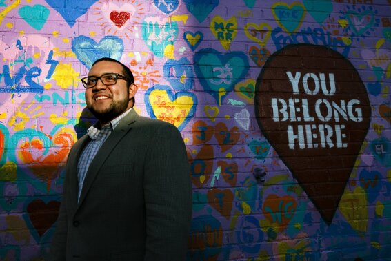 FILE - In this Tuesday, March 10, 2020 file photo, Ricky Hurtado, the first Latino candidate to run for North Carolina's House of Representatives, poses for a portrait by a mural in Graham, N.C. It's been a tumultuous few months for Hurtado. In November, the 32-year-old son of Salvadoran immigrant won a seat in the North Carolina state legislature as a Democrat representing a suburban slice of Alamance County. (AP Photo/Jacquelyn Martin)