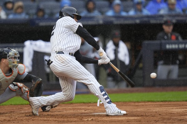 New York Yankees' Juan Soto hits a three-run double during the seventh inning of the baseball game against the Detroit Tigers at Yankee Stadium Sunday, May 5, 2024, in New York. (AP Photo/Seth Wenig)