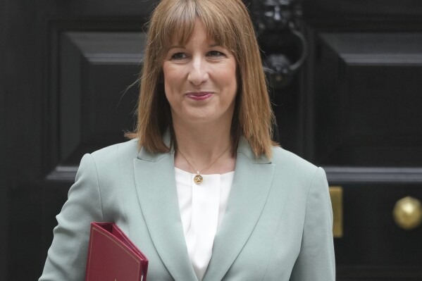 Britain's Chancellor of the Exchequer Rachel Reeves leaves 11 Downing Street to announce the government's Spending Review in Parliament, in London, Wednesday, June 11, 2025. (AP Photo/Kin Cheung)