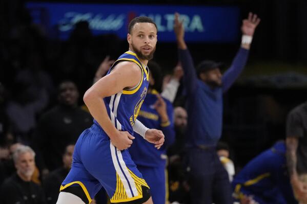 Golden State Warriors guard Stephen Curry runs back after scoring during the first half in Game 6 of an NBA basketball Western Conference semifinal series against the Los Angeles Lakers Friday, May 12, 2023, in Los Angeles. (AP Photo/Ashley Landis)
