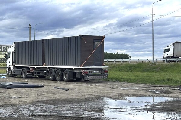 This photo released by Governor of Irkutsk region Igor Kobzev telegram channel on Sunday, June 1, 2025, shows a truck used to release some of the Ukrainian drones that attacked Russian air bases in the Irkutsk region, more than 4,000 kilometers (2,500 miles) from Ukraine. (Governor of Irkutsk region Igor Kobzev telegram channel via AP)