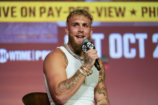 FILE - Jake Paul speaks during a news conference Monday, Sept. 12, 2022, in Los Angeles. Jake Paul is teaming up with USA Boxing to put a spotlight on the nation’s top competitors at the 2024 Paris Olympics. The YouTube star and professional boxer will train with Olympic qualifiers and other fighters at USA Boxing’s home base in Colorado Springs next year, and he will amplify their stardom on his social media channels. (AP Photo/Ashley Landis, File)