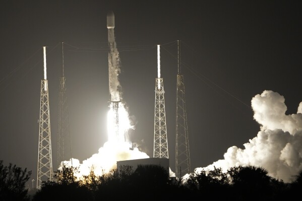 FILE - A SpaceX Falcon 9 rocket, with a payload including two lunar rovers from Japan and the United Arab Emirates, lifts off from Launch Complex 40 at the Cape Canaveral Space Force Station in Cape Canaveral, Fla., on Dec. 11, 2022. But later in April 2023, the spacecraft from a Japanese company apparently crashed while attempting to land on the moon. Japan now hopes to make the world's first "pinpoint landing" on the moon early Saturday, Jan. 20, 2024, joining a modern push for lunar contact with roots in the Cold War-era space race between the United States and the Soviet Union. (AP Photo/John Raoux, File)