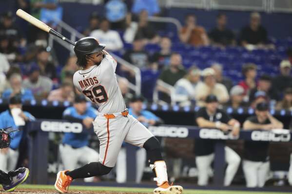 San Francisco Giants' Luis Matos hits a three-run home run during the fourth inning of a baseball game against the Miami Marlins, Sunday, June 1, 2025, in Miami. (AP Photo/Lynne Sladky)
