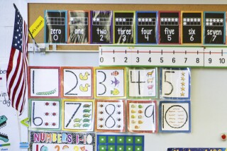 FILE - Instructional materials are posted on a wall of a kindergarten class in Maryland on Tuesday, Jan. 24, 2023. The proportion of U.S. kindergartners exempted from school attendance vaccination requirements has hit its highest level ever, 3%, U.S. health officials said Thursday, Nov. 9, 2023. (AP Photo/Julia Nikhinson, File)