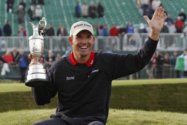 FILE - Ireland's Padraig Harrington holds the trophy after winning the British Open Golf Championship at Carnoustie, Scotland, July 22, 2007. Harrington is to be inducted into the World Golf Hall of Fame, Monday, June 10, 2024, in Pinehurst, N.C. (AP Photo/Matt Dunham, File)