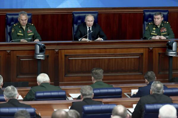 Russian President Vladimir Putin, center, speaks as Defense Minister Sergei Shoigu, left, and Chief of the General Staff Gen. Valery Gerasimov attend a meeting with senior military officers in Moscow, Russia, on Wednesday, Dec. 21, 2022. Putin sent Russian forces into Ukraine on Feb. 24, 2022, and appears determined to prevail. (Sergey Fadeichev, Sputnik, Kremlin Pool Photo via AP, File)