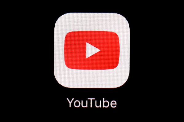 FILE - This March 20, 2018, file photo shows the YouTube app on an iPad in Baltimore. YouTube on Friday, March 5, 2021, said it has removed five channels run by Myanmar’s military for violating its community guidelines and terms of service. (AP Photo/Patrick Semansky, File)
