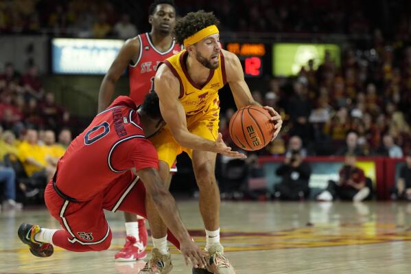 St. John's guard Posh Alexander (0) and Iowa State guard Gabe Kalscheur (22) collide during the first half of an NCAA college basketball game, Sunday, Dec. 4, 2022, in Ames, Iowa. (AP Photo/ Matthew Putney)