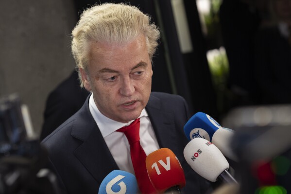Geert Wilders, leader of the far-right party PVV, or Party for Freedom, talks to the media after a meeting with speaker of the House Vera Bergkamp, two days after Wilders won the most votes in a general election, in The Hague, Netherlands, Friday Nov. 24, 2023. (AP Photo/Peter Dejong)
