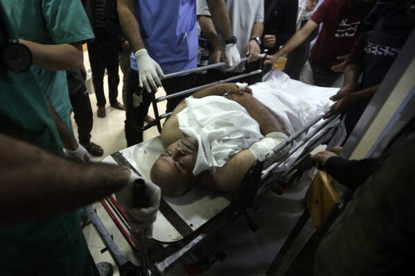 Al Jazeera correspondent Wael Dahdouh is treated at Nasser hospital after being wounded in an Israeli strike in Khan Younis refugee camp, southern Gaza Strip, Friday, Dec. 15, 2023. (AP Photo/Mohammed Dahman)
