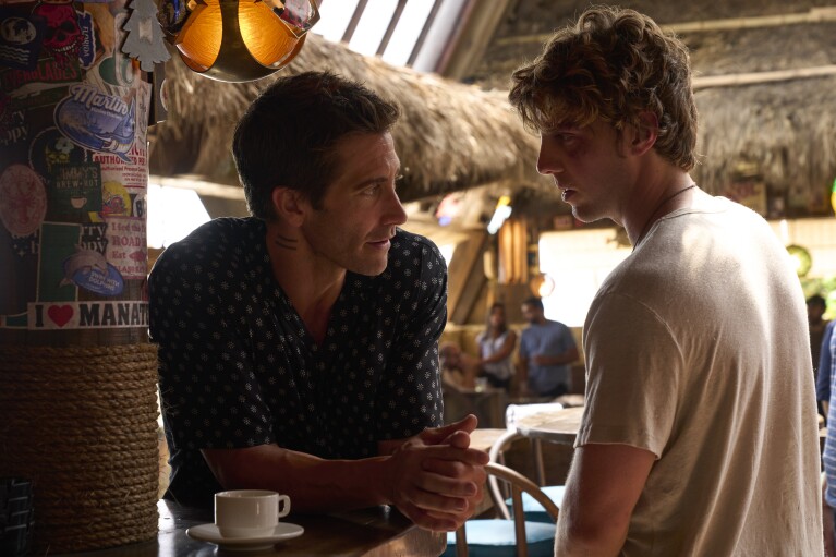 This image released by Prime Video shows Jake Gyllenhaal, left, and Lukas Gage in a scene from "Road House." (Laura Radford/Prime Video via AP)