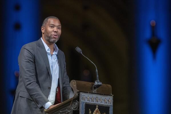FILE - In this Nov. 21, 2019 file photo, author Ta-Nehisi Coates speaks during the Celebration of the Life of Toni Morrison at the Cathedral of St. John the Divine in New York. This past week's hiring of Nikole Hannah-Jones and Coates serves as confirmation that Howard University intends to dive neck-deep into America’s divisive racial debate. (AP Photo/Mary Altaffer, File)
