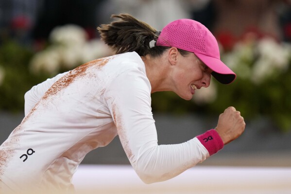 Poland's Iga Swiatek celebrates after winning the women's final against Belarus' Aryna Sabalenka at the Mutua Madrid Open tennis tournament held in Madrid, Spain on Saturday, May 4, 2024. AP Photo/Bernat Almangue)