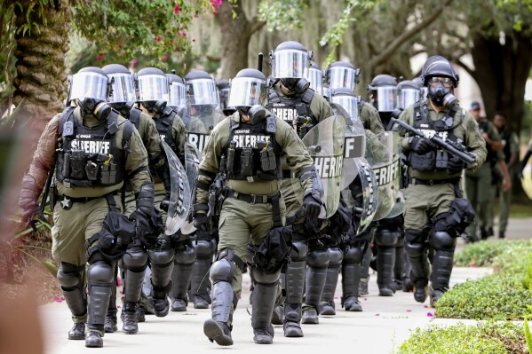 Law enforcement officers approach pro-Palestinian protesters as they congregate at MLK Plaza at the University of South Florida, Tuesday, April 30, 2024, in Tampa, Fla. (Douglas R. Clifford/Tampa Bay Times via AP, File)