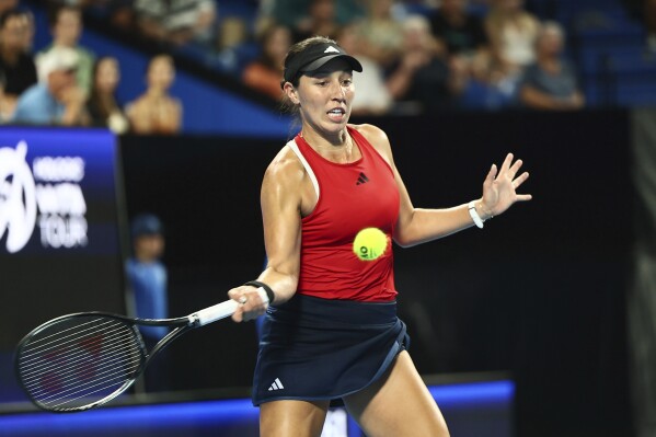 Jessica Pegula of the United States hits a return shot to Ajla Tomljanovic of Australia during the United Cup tennis tournament in Perth, Australia, Monday, Jan. 1, 2024. (AP Photo/Trevor Collens)