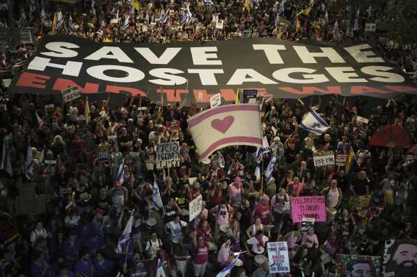 People take part in a protest demanding the end of the war and immediate release of hostages held by Hamas in the Gaza Strip, and against Prime Minister Benjamin Netanyahu's government in Tel Aviv, Israel, Saturday, May 24, 2025. (AP Photo/Leo Correa)