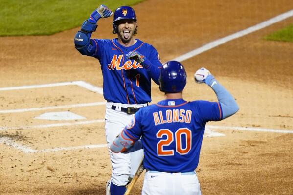 New York Mets' Jeff McNeil, left, celebrates with Pete Alonso after hitting a home run during the first inning in the second baseball game of the team's doubleheader against the Washington Nationals, Tuesday, Oct. 4, 2022, in New York. (AP Photo/Frank Franklin II)