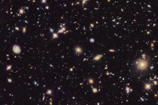 This image made available by the European Space agency shows galaxies in the Hubble Ultra Deep Field 2012, an improved version of the Hubble Ultra Deep Field image. A study from the Max Planck Institute in Germany published Thursday, Sept. 12, 2019, in the journal Science uses a new technique to come up with a rate that the universe is expanding that is nearly 18% higher than the number scientists had been using since the year 2000. (NASA, ESA, R. Ellis (Caltech), HUDF 2012 Team via AP)