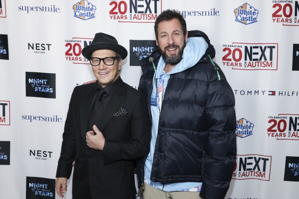 Rob Schneider, left, and Adam Sandler attend the Night of Too Many Stars comedy benefit for autism programs at the Beacon Theatre, Monday, Dec. 11, 2023, in New York. (Photo by CJ Rivera/Invision/AP)