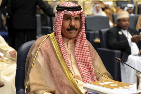 FILE - Kuwait's then-Crown Prince Sheik Nawaf Al-Ahmad Al-Jaber Al-Sabah attends the closing session of the 25th Arab Summit in Bayan Palace in Kuwait City, Wednesday, March 26, 2014. Kuwait's ruling emir, the 86-year-old Sheikh Nawaf Al Ahmad Al Sabah, has died, state television reported Saturday, Dec. 16, 2023. (AP Photo/Nasser Waggi, File)