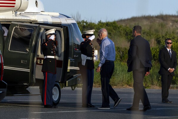 President Joe Biden boards the Marine One helicopter at Gordons Pond State Park at Rehoboth Beach, Del., Thursday, June 20, 2024, en route to Camp David. (AP Photo/Jacquelyn Martin)
