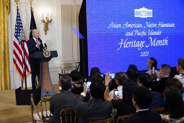 FILE - President Joe Biden speaks before a screening of the series "American Born Chinese" in the East Room of the White House in Washington, in celebration of Asian American, Native Hawaiian, and Pacific Islander Heritage Month, May 8, 2023. About 7 in 10 Asian American and Pacific Islanders in the United States believe the country is headed in the wrong direction and only about 1 in 10 believe democracy is working extremely or very well according to a new poll from AAPI Data and The Associated Press-NORC Center for Public Affairs Research. (AP Photo/Susan Walsh, File)