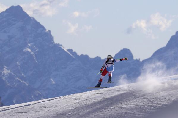FILE - Switzerland's Priska Nufer speeds down the course during an alpine ski, women's World Cup downhill training, in Cortina d'Ampezzo, Italy, Friday, Jan. 21, 2022. After three consecutive Winter Games in Asia, plus the 2010 edition in Vancouver, the 2026 Olympics will mark a return to Europe and the Alps. The 2026 Games will be the most widespread Olympics ever, with venues spread out over 22,000 square kilometers (nearly 10,000 square miles) over a vast swath of northern Italy — from the regions of Lombardy and Veneto to the provinces of Trento and Bolzano. (AP Photo/Alessandro Trovati, File)