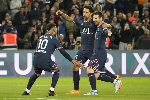 PSG's Neymar, left, and Marquinhos, center, celebrate as Lionel Messi, right, scored the opening goal during the French League One soccer match between Paris Saint Germain and Lens at Parc des Princes stadium in Paris, Saturday, April 23, 2022. (AP Photo/Michel Euler)