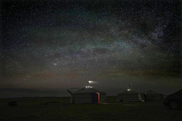 Stars light up the night sky over Lkhaebum's ger, a portable, round tent insulated with sheepskin, in the remote Munkh-Khaan region of the Sukhbaatar district, in southeast Mongolia, Tuesday, May 16, 2023. (AP Photo/Manish Swarup)