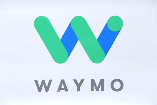 The Waymo logo is shown at the North American International Auto Show in Detroit, Sunday, Jan. 8, 2017. (AP Photo/Paul Sancya, File)