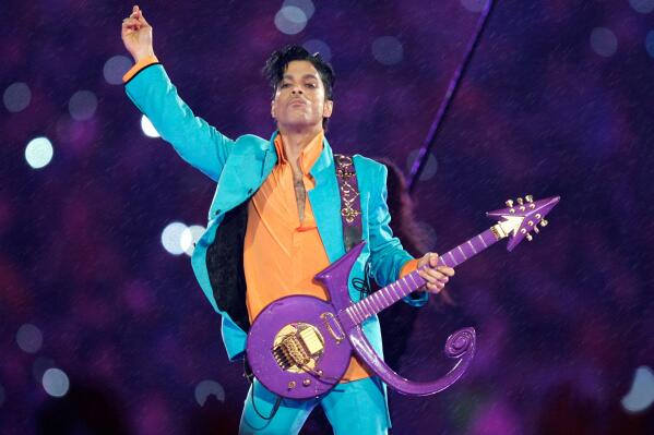 FILE - In this Feb. 4, 2007, file photo, Prince performs during the halftime show at the Super Bowl XLI football game in Miami.  Minnesota's Congressional delegation on Monday, Oct. 25, 2021, is introducing a resolution to posthumously award the Congressional Gold Medal to pop superstar Prince, citing his "indelible mark on Minnesota and American culture,” The Associated Press has learned. (AP Photo/Chris O'Meara, File)