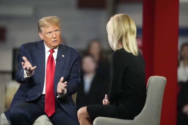 Republican presidential candidate former President Donald Trump speaks during a Fox News Channel town hall Tuesday, Feb. 20, 2024, in Greenville, S.C., as moderator Laura Ingraham listens. (AP Photo/Chris Carlson)