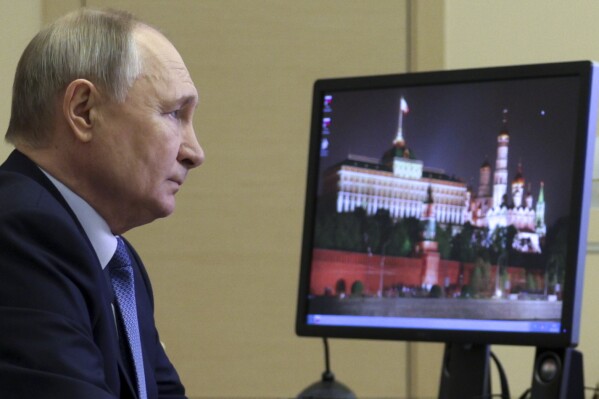 Russian President Vladimir Putin attends a meeting with the members of the Security Council via videoconference at Novo-Ogaryovo state residence outside of Moscow, Russia, Monday, Jan. 20, 2025. (Gavriil Grigorov, Sputnik, Kremlin Pool Photo via AP)