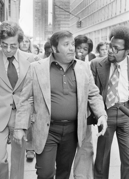 FILe - In this Sept. 4, 1975 file photo, Charles O'Brien,  Jimmy Hoffa's adopted son, leaves the federal court building in Detroit.  O'Brien, a longtime associate of the late Jimmy Hoffa who became a leading suspect in the Teamsters boss' disappearance, has died. O'Brien's stepson, Harvard Law School professor Jack Goldsmith, said in a blog post that O'Brien died Thursday, Feb. 13m 2020 in Boca Raton, Fla., from what appeared to be a heart attack. (AP Photo/Richard Sheinwald, File)