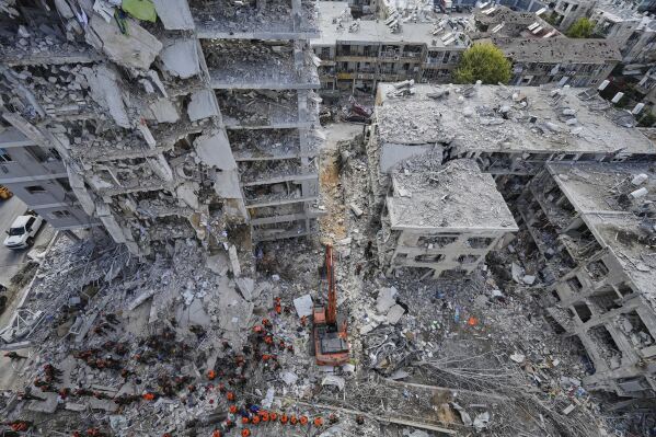 Israeli soldiers search through the rubble of residential buildings destroyed by an Iranian missile strike in Bat Yam, central Israel, June 15, 2025. (AP Photo/Baz Ratner, File)