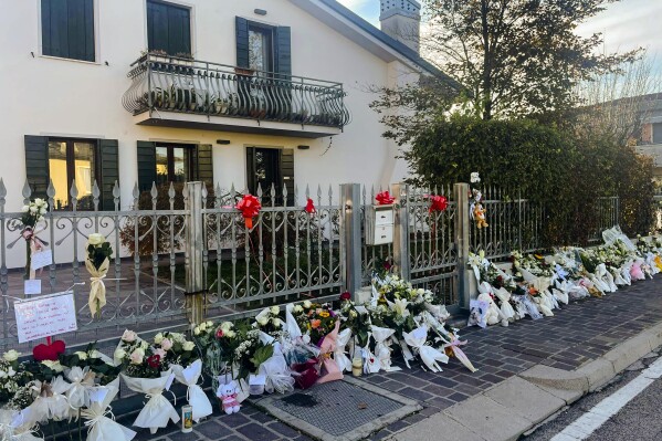 Flowers are left outside the house where 22-year-old Giulia Cecchettin used to live with her family in Vigonovo, near Venice, northern Italy, Sunday, Nov. 19, 2023. Her body, reportedly with multiple stab wounds, was found wrapped in plastic on Saturday in a ditch near Venice. Police in Germany over the weekend arrested Filippo Turetta, 21, who had been on the run since Nov. 11, when he was last seen arguing with Giulia Cecchettin. (Contaldo/LaPresse via AP)