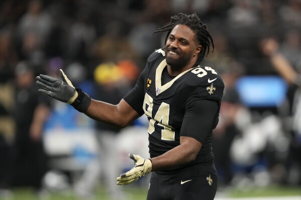 New Orleans Saints defensive end Cameron Jordan reacts on the field before an NFL football game against the Las Vegas Raiders, Sunday, Dec. 29, 2024, in New Orleans. (AP Photo/Gerald Herbert)