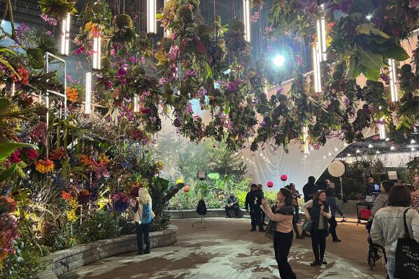 This March 3, 2023, image provided by Jessica Damiano shows "FLORASTRUCK," the orchid-adorned entrance garden at the 2023 Philadelphia Flower Show held at the Pennsylvania Convention Center in Philadelphia. (Jessica Damiano via AP)