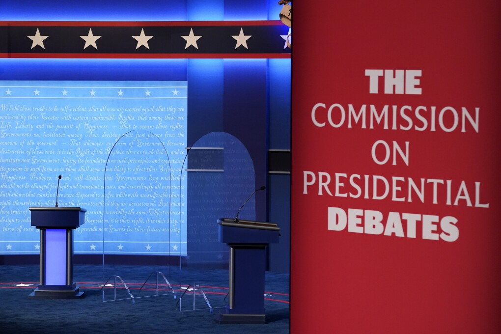 FILE - Clear protective panels stand onstage between lecterns as preparations take place for the second Presidential debate at Belmont University, Oct. 21, 2020, in Nashville, Tenn. Three debates for next year's presidential general election are set to be held in college towns in Texas, Virginia and Utah between Sept. 16 and Oct. 9, with the lone vice presidential debate happening in-between in Pennsylvania — though whether the Republican nominee will participate remains to be seen. The nonpartisan Commission on Presidential Debates announced Monday, Nov. 20, 2023, that presidential candidates will first be scheduled to meet Sept. 16. (AP Photo/Patrick Semansky, File)
