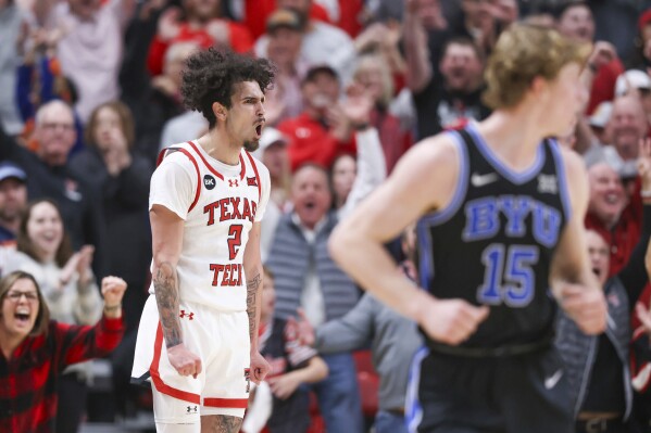 Texas Tech's guard Pop Isaacs (2) celebrates during the second half of the team's NCAA college basketball game against BYU, Saturday, Jan. 20, 2024, in Lubbock, Texas. (AP Photo/Chase Seabolt)