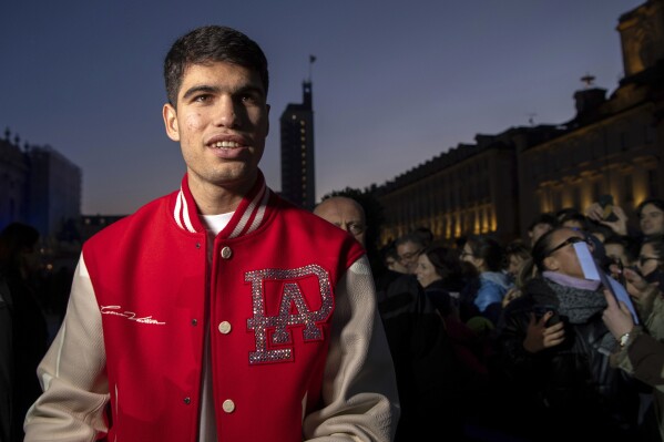 Spain's Carlos Alcaraz looks on during the Blue Carpet & Media Day of the Nitto ATP Finals in Turin, Italy, Friday Nov. 10, 2023. (Marco Alpozzi/LaPresse via AP)