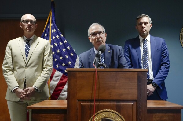 Department of Justice Special Counsel David Weiss, center, accompanied by by federal prosecutors Derek Hines, right, and Leo Wise speaks during a news conference, Tuesday, June 11, 2024, in Wilmington, Del. Weiss says Hunter Biden's conviction on federal gun crimes is a reminder that no one is above the law.  (AP Photo/Matt Slocum)