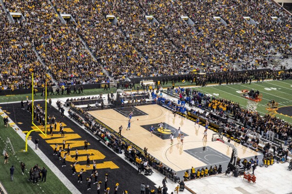 Players transition down the court during the Iowa Hawkeyes women's basketball team's NCAA Crossover at Kinnick exhibition basketball game against the DePaul Blue Demons in Iowa City, Iowa, on Sunday, Oct. 15, 2023. (Nick Rohlman/The Gazette via AP)