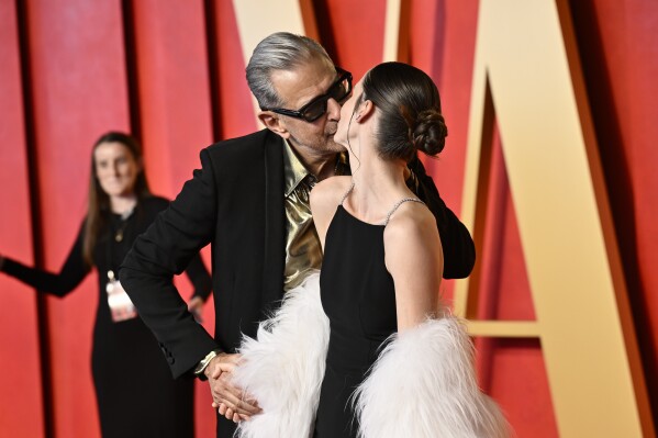Jeff Goldblum, left, and Emilie Livingston arrive at the Vanity Fair Oscar Party on Sunday, March 10, 2024, at the Wallis Annenberg Center for the Performing Arts in Beverly Hills, Calif. (Photo by Evan Agostini/Invision/AP)