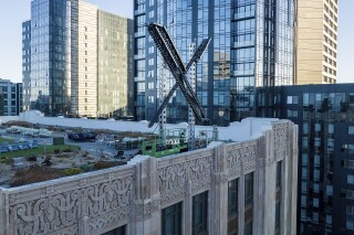 FILE - An "X" sign rests atop the company headquarters in downtown San Francisco, on July 28, 2023. Elon Musk's social media company, formerly known as Twitter, has filed a lawsuit against liberal advocacy group Media Matters for America. X says Media Matters manufactured a report to show advertisers' posts alongside neo-Nazi and white nationalist posts in order to "drive advertisers from the platform and destroy X Corp.” (AP Photo/Noah Berger, File)