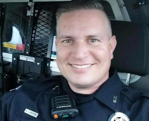 This family photo provided by the Mesquite Police Department, in Mesquite, Texas, shows Officer Richard Houston. Houston was killed Friday, Dec. 3, 2021, while responding to a disturbance call outside a suburban Dallas supermarket. (Family Photo/Courtesy of Mesquite Police Department via AP)
