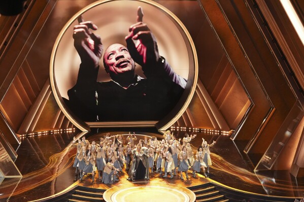 Queen Latifah, center, performs "Ease on Down the Road" during the Oscars on Sunday, March 2, 2025, at the Dolby Theatre in Los Angeles. (AP Photo/Chris Pizzello)