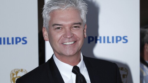 British television personality Phillip Schofield arrives at The British Academy Television Awards in London, Britain, Sunday, May 22, 2011. ITV, best known for shows like "Downton Abbey," "Coronation Street" and "The X Factor," has been under intense public scrutiny since Phillip Schofield, a long-time host on the channel's popular morning show, quit last month after admitting he lied about his affair with a much younger male colleague. (AP Photo/Paul Jeffers)